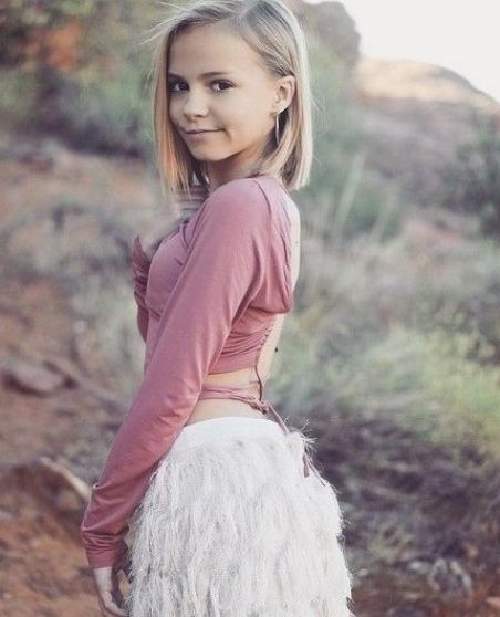 An 11-Year-Old Girl with Bob Haircut Wearing Specs